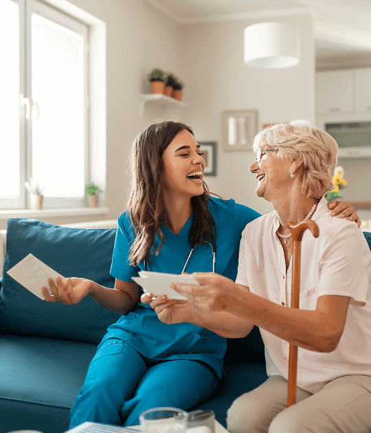 Disability support worker shares a joyful moment with aged care clients