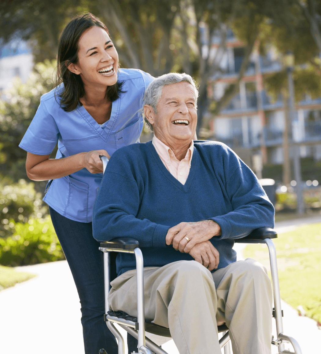 Caring support worker assisting an elderly man with in-home care services in Camp Hill, Brisbane.